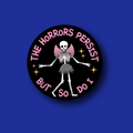 Interchangeable Badge Topper: The horrors persist
