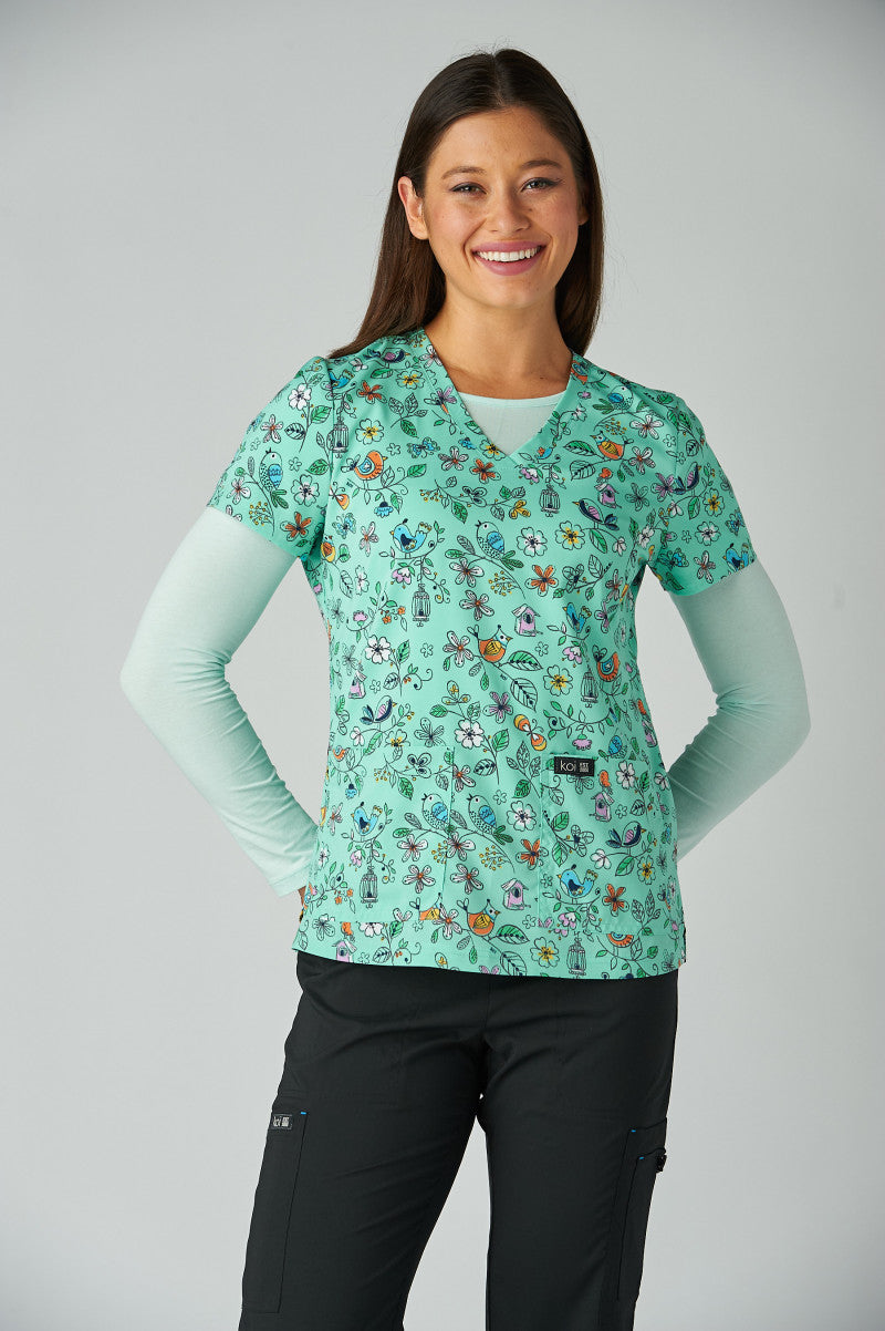 Front view koi Basics Leslie Bird Cage print scrub top