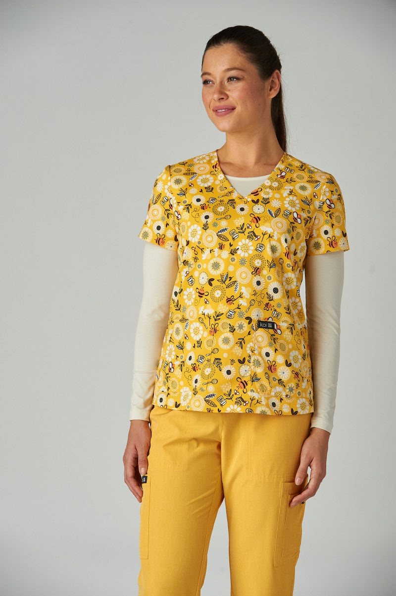 Front view of koi basics Honey Bees women's scrub top.