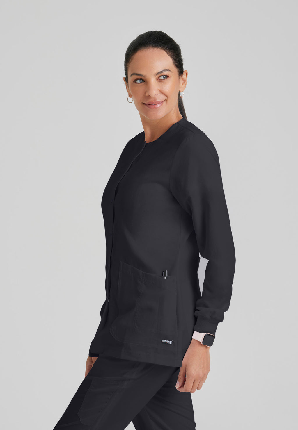 Side view of Grey's Anatomy Jamie Warm Up Scrub Jacket in Steel colour.