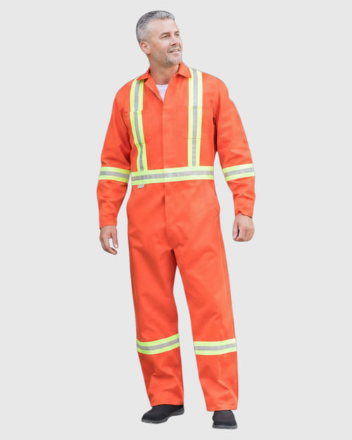 A man wearing a bright orange high-visibility one-piece coverall with reflective yellow-green stripes, standing against a light gray background.