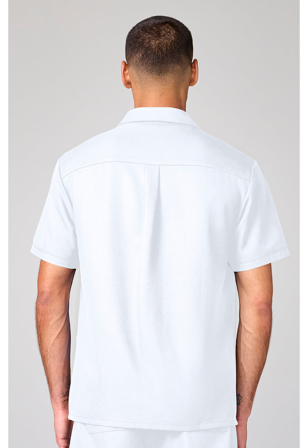 Back view of the Cherokee Workwear Ultra Men's Full Zip Short Sleeve Jacket in color White.