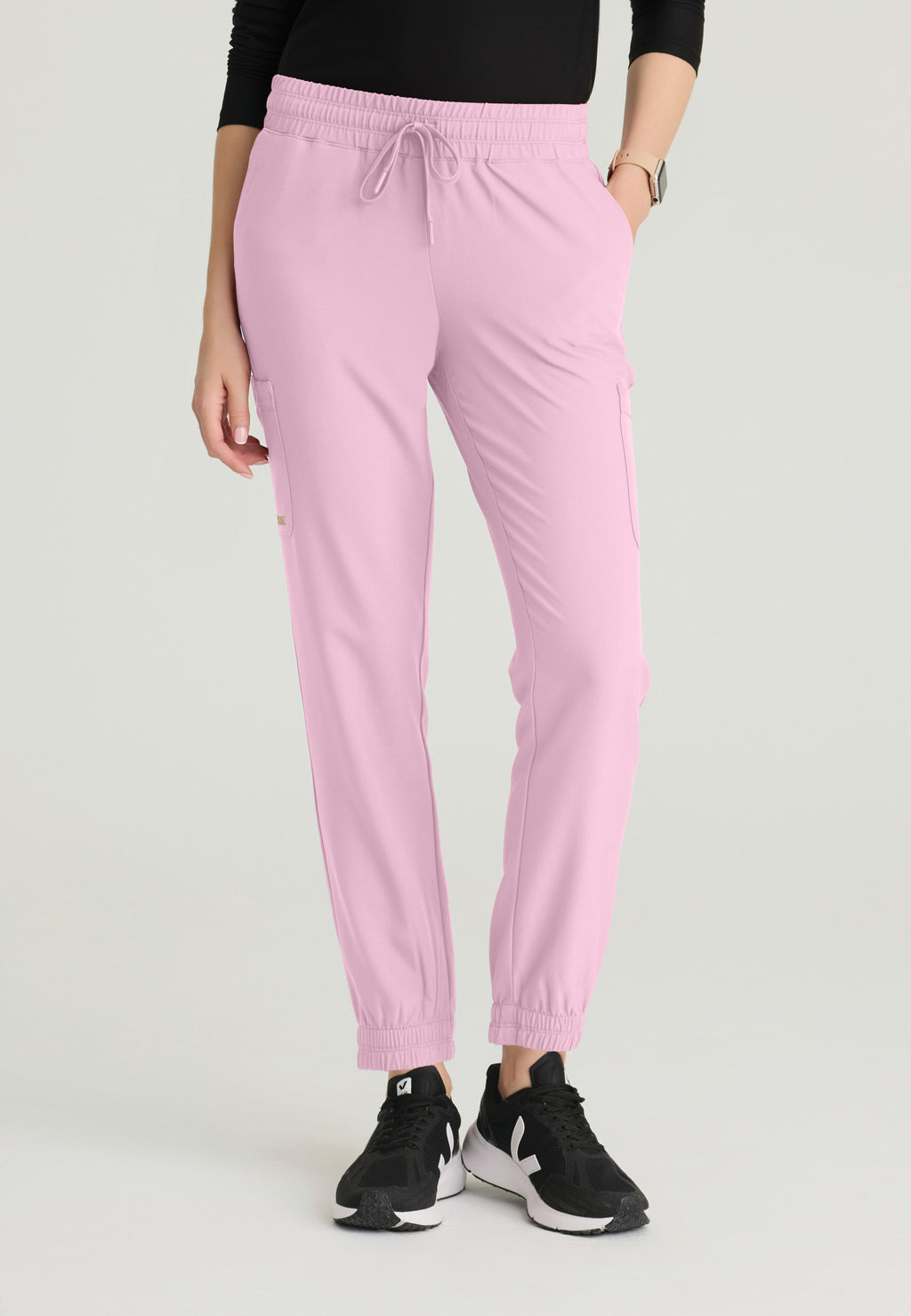 Front view of the Grey's Anatomy Evolve women's Terra scrub jogger in the colour Misty Pink.