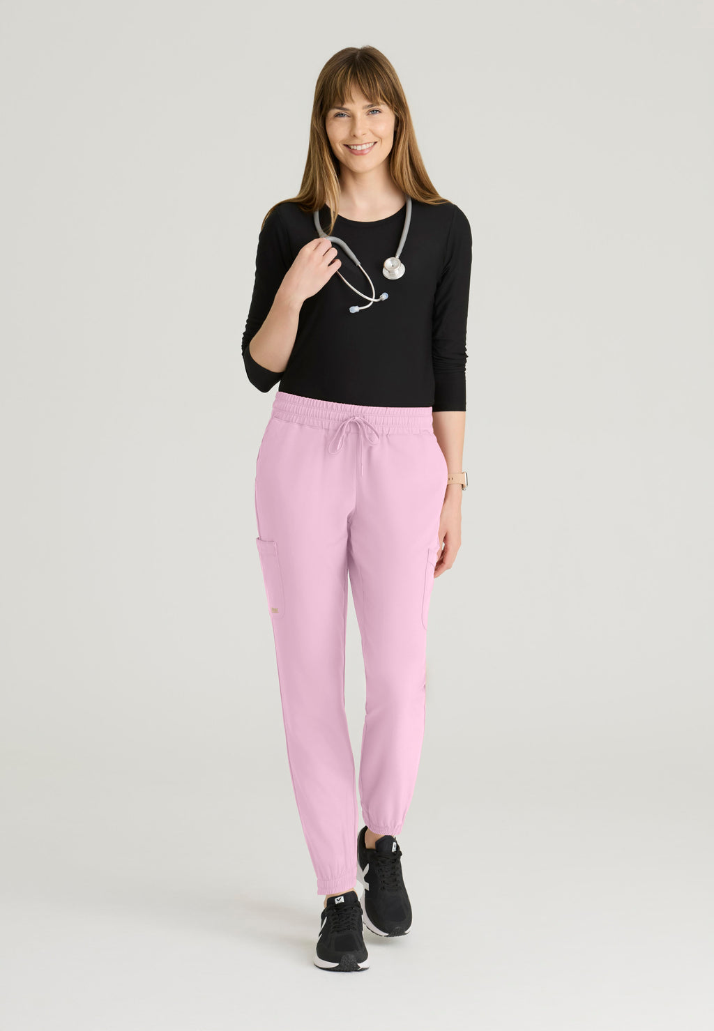 Full view of the Grey's Anatomy Evolve women's Terra scrub jogger in the colour Misty Pink.
