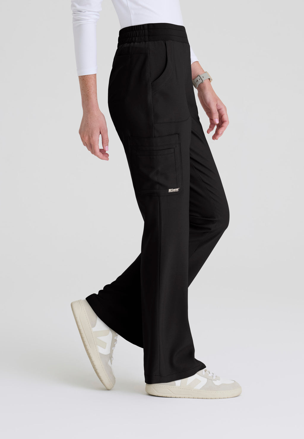 Side view of the Grey's Anatomy Evolve women's Sky scrub pant in the colour Black.