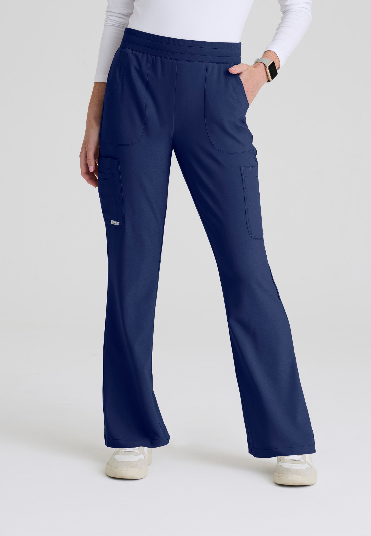 Front view of the Grey's Anatomy Evolve women's Sky scrub pant in the colour Indigo.