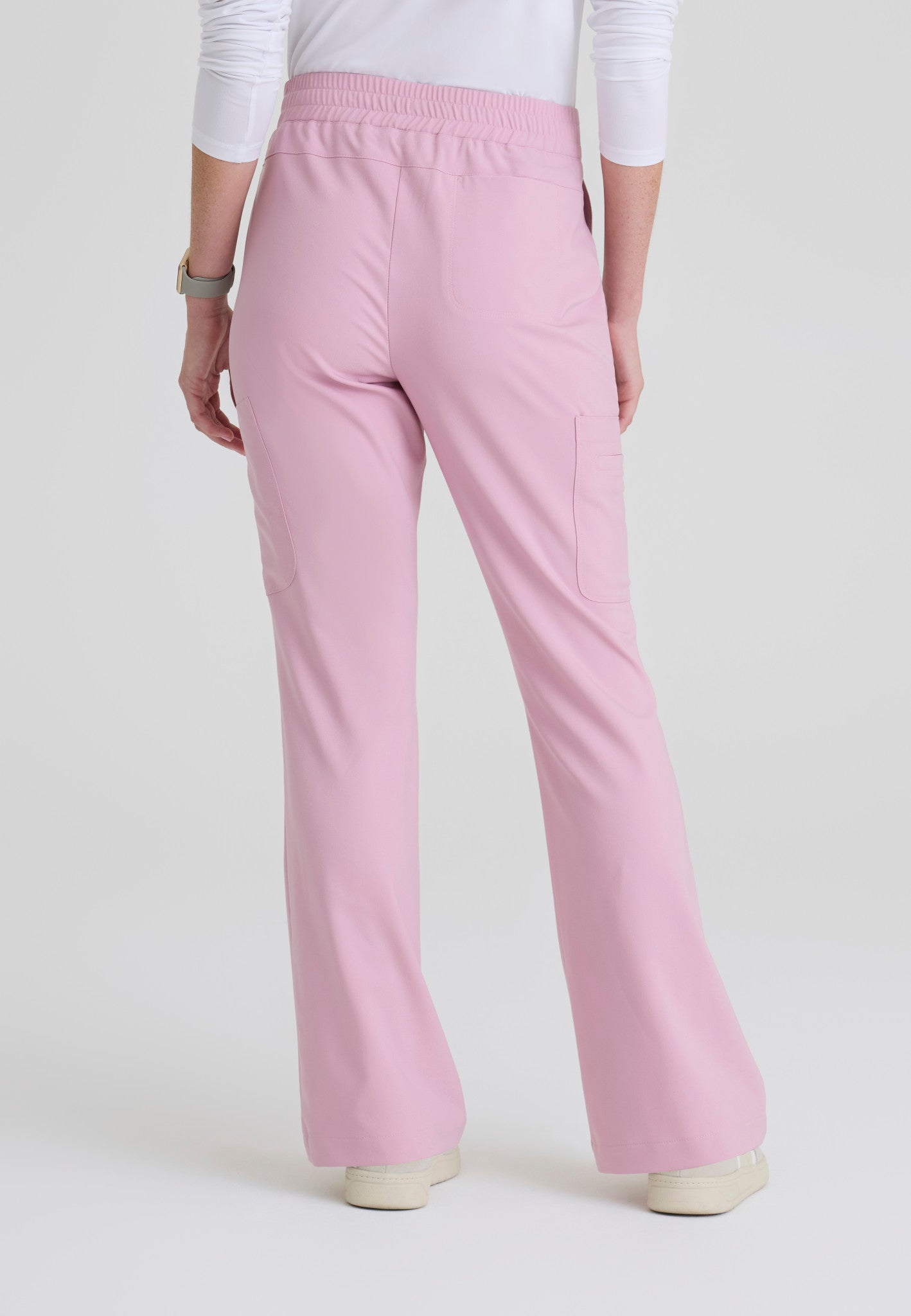 Back view of the Grey's Anatomy Evolve women's Sky scrub pant in the colour Misty Pink.
