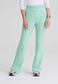 Front view of the GSSP729 Grey's Anatomy Evolve Sky Fit and Flare Scrub pant in the colour Soft Melon.
