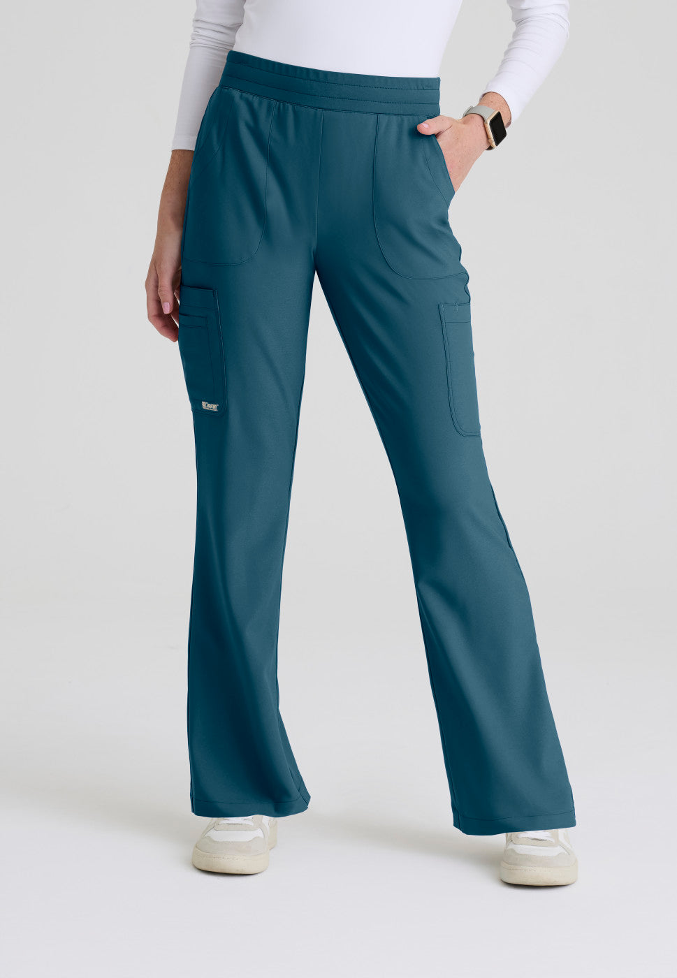 Front view of the GSSP729 Grey's Anatomy Evolve Sky Fit and Flare Scrub pant in the colour Bahama.