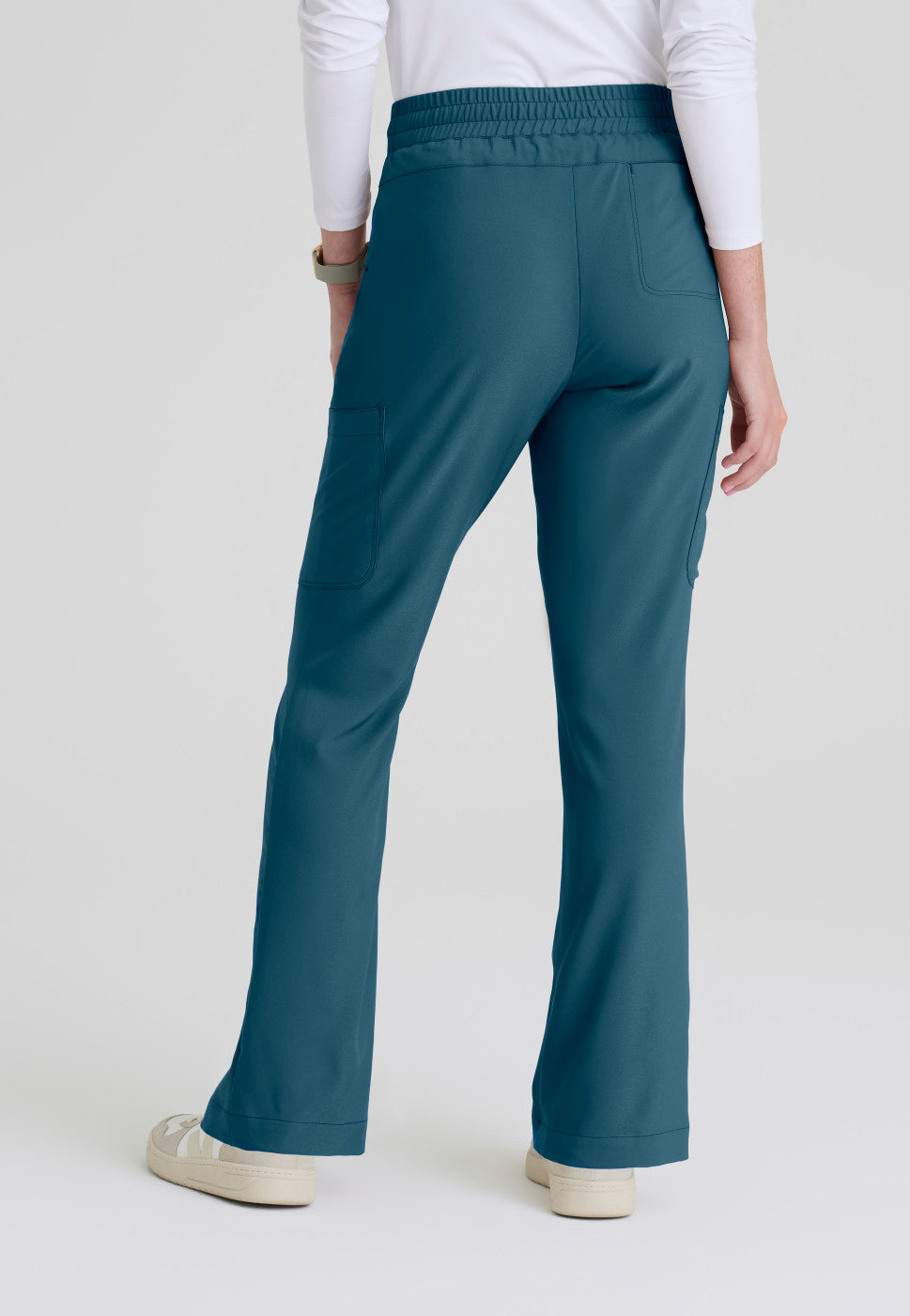 Back view of the GSSP729 Grey's Anatomy Evolve Sky Fit and Flare Scrub pant in the colour Bahama.