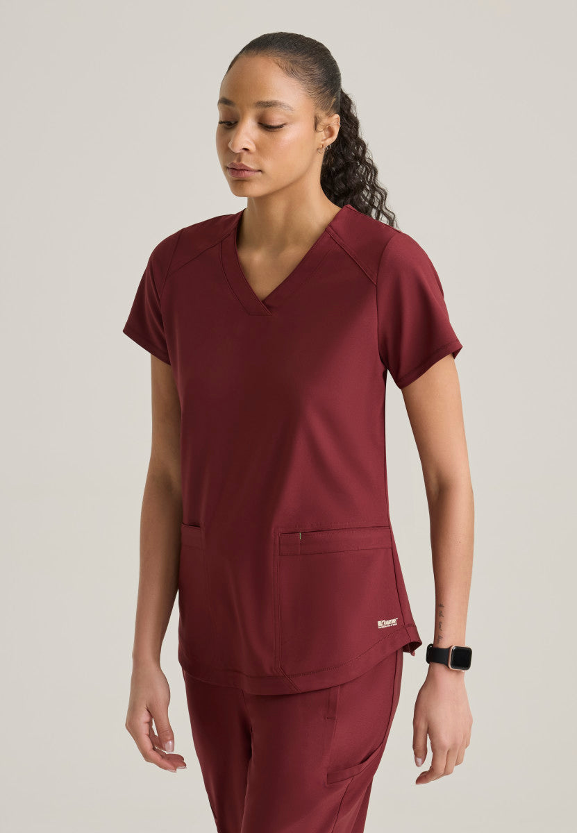 Side view of the Grey's Anatomy™ by Barco Evolve GSST180 Women's Rhythm Scrub top in the colour Chestnut.