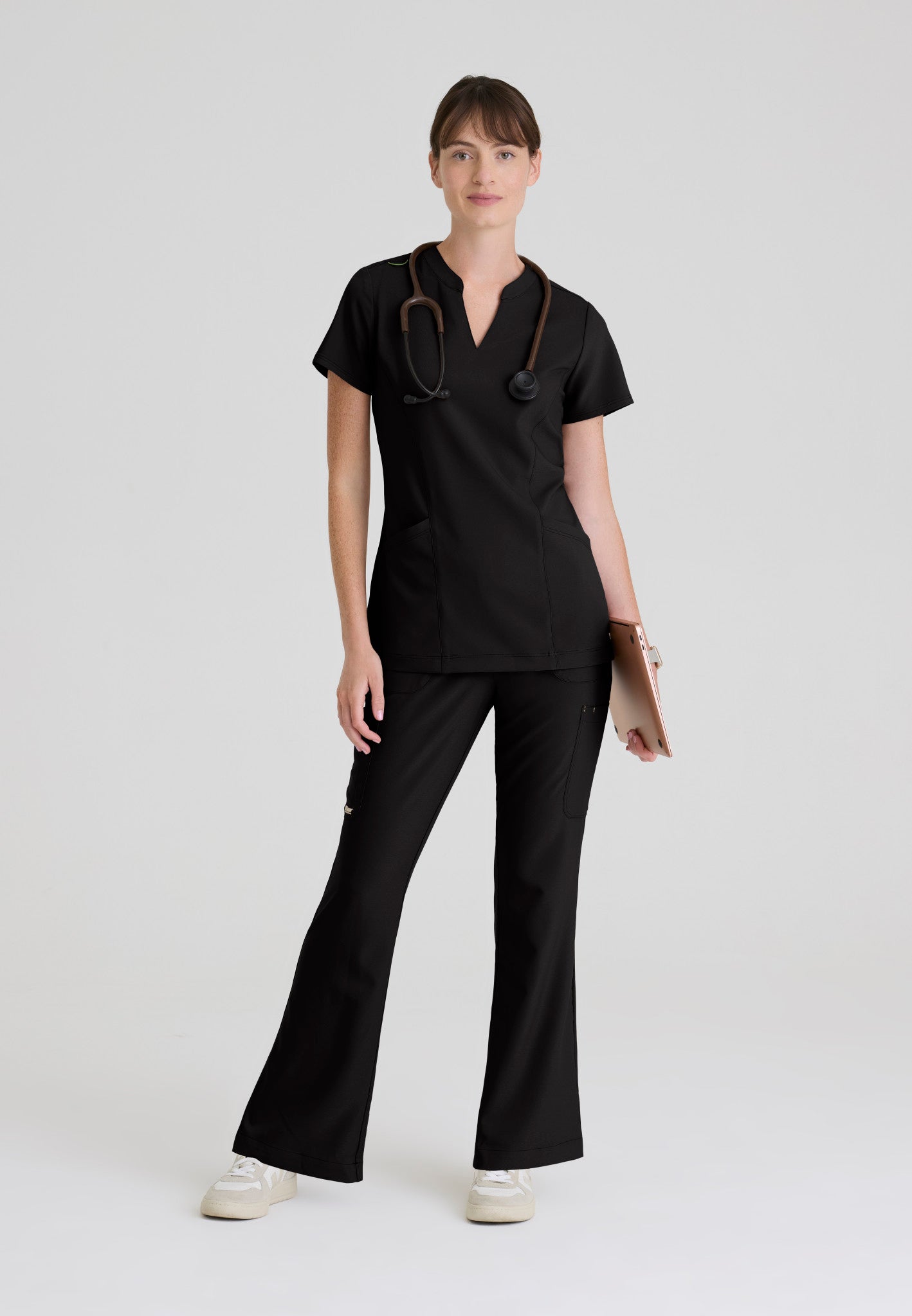 Full view of the Grey's Anatomy Evolve women's Sky scrub top in the colour Black.