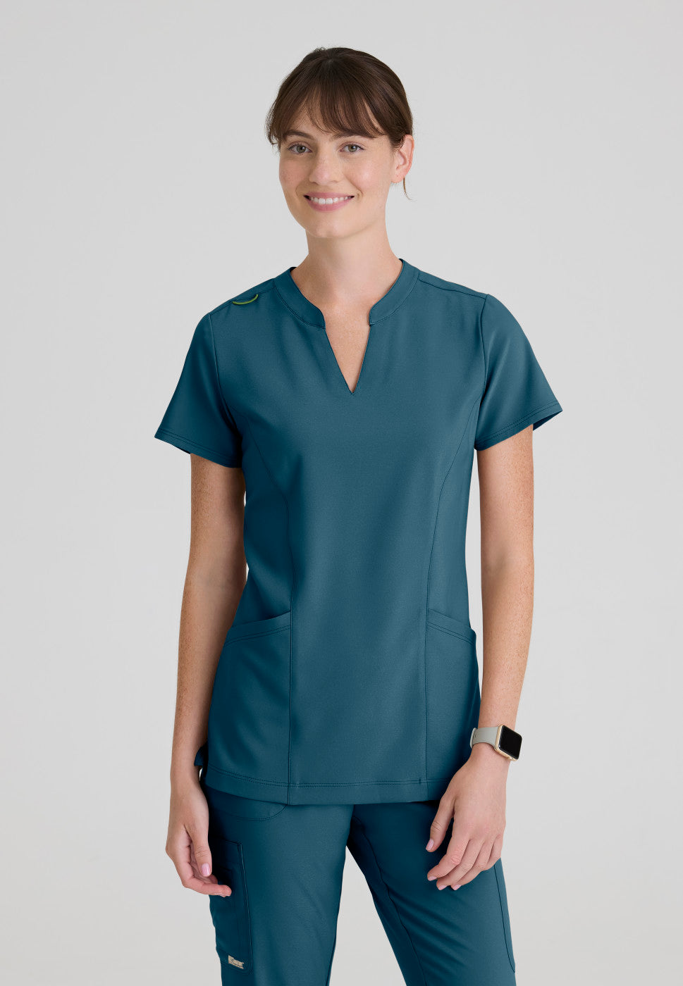 Front view of the GSST298 Grey's Anatomy Evolve Sky Banded Scrub Top in the colour Bahama.