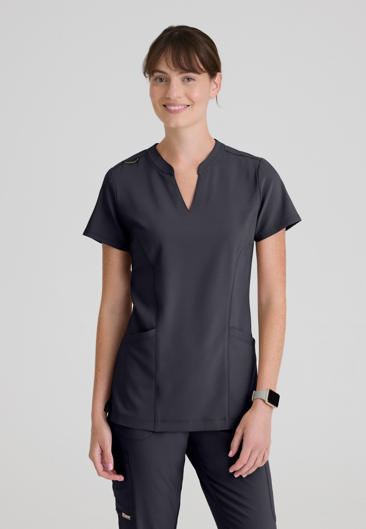 Front view of the Grey's Anatomy Evolve women's Sky scrub top in the colour Steel.