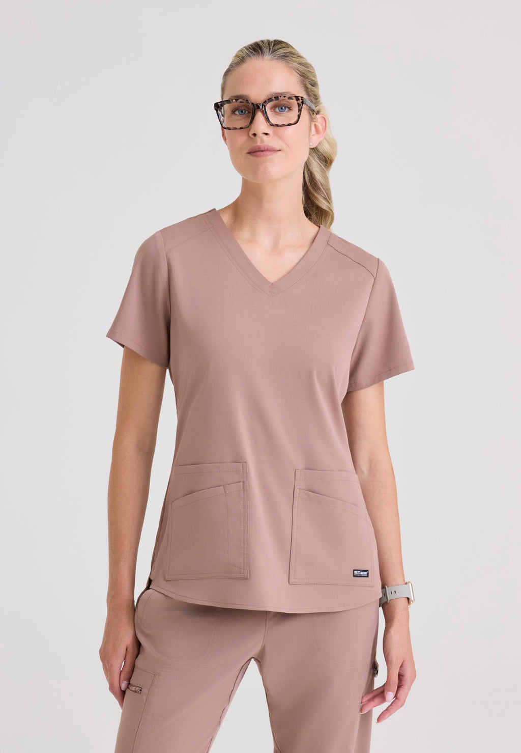 Front view Grey's Anatomy Spandex Stretch Emma Scrub Top in the colour Warm Mocha.