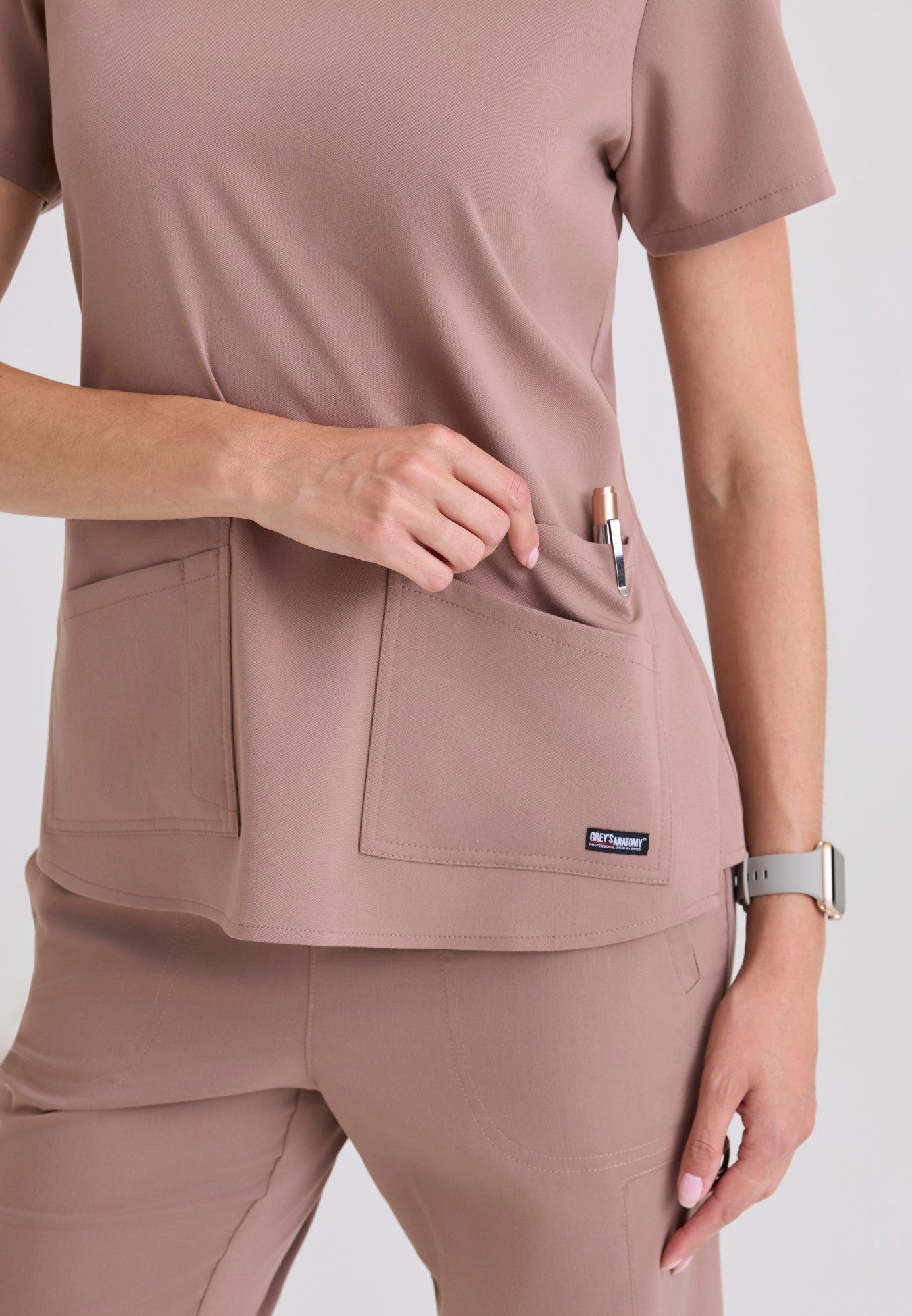 Close up of the Grey's Anatomy Spandex Stretch Emma Scrub top in the colour Warm Mocha.