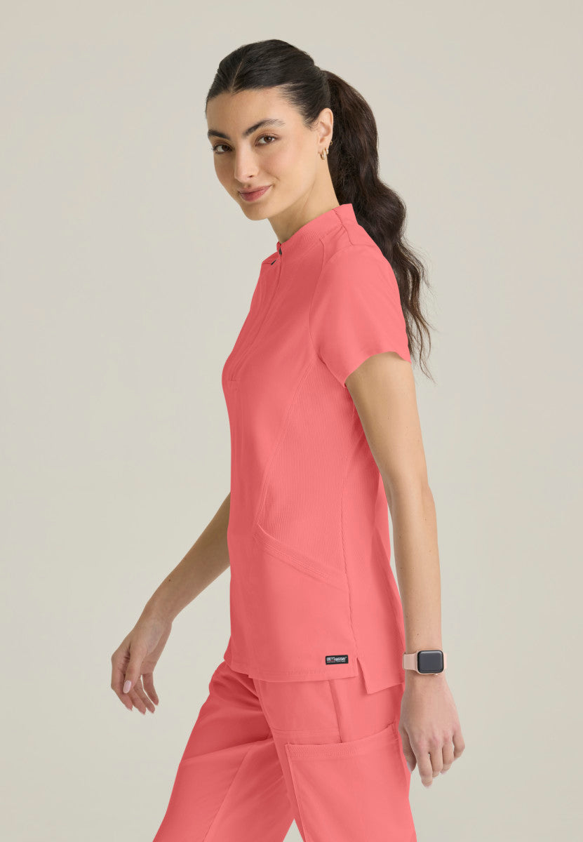 Side facing image Kristi Zip Front Scrub Top Grey's Anatomy Spandex Stretch GRST292 in colour Coral Bloom.