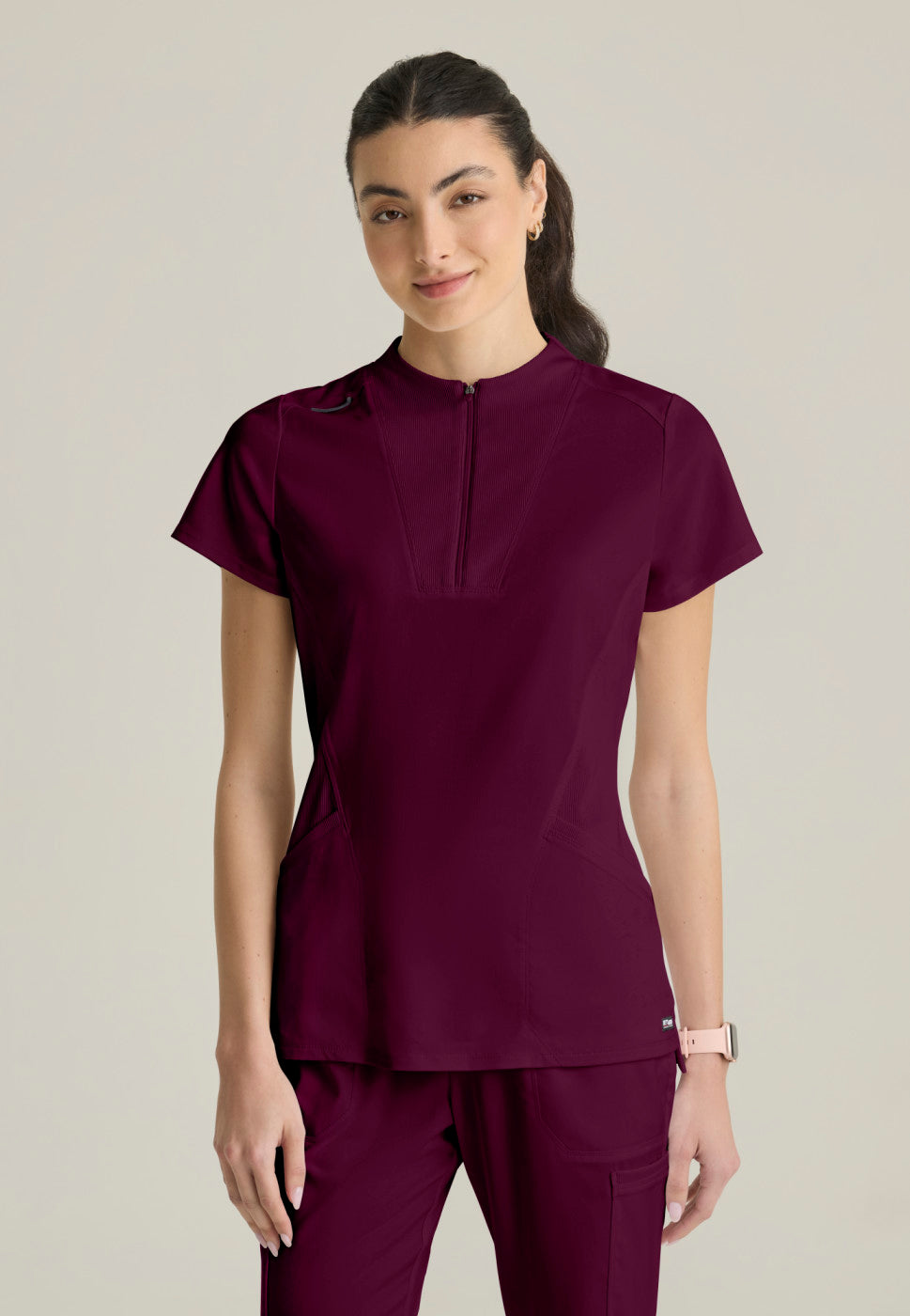 Front view of the GRST292 Women's Grey's Anatomy Kristi Scrub Top in the colour WINE.