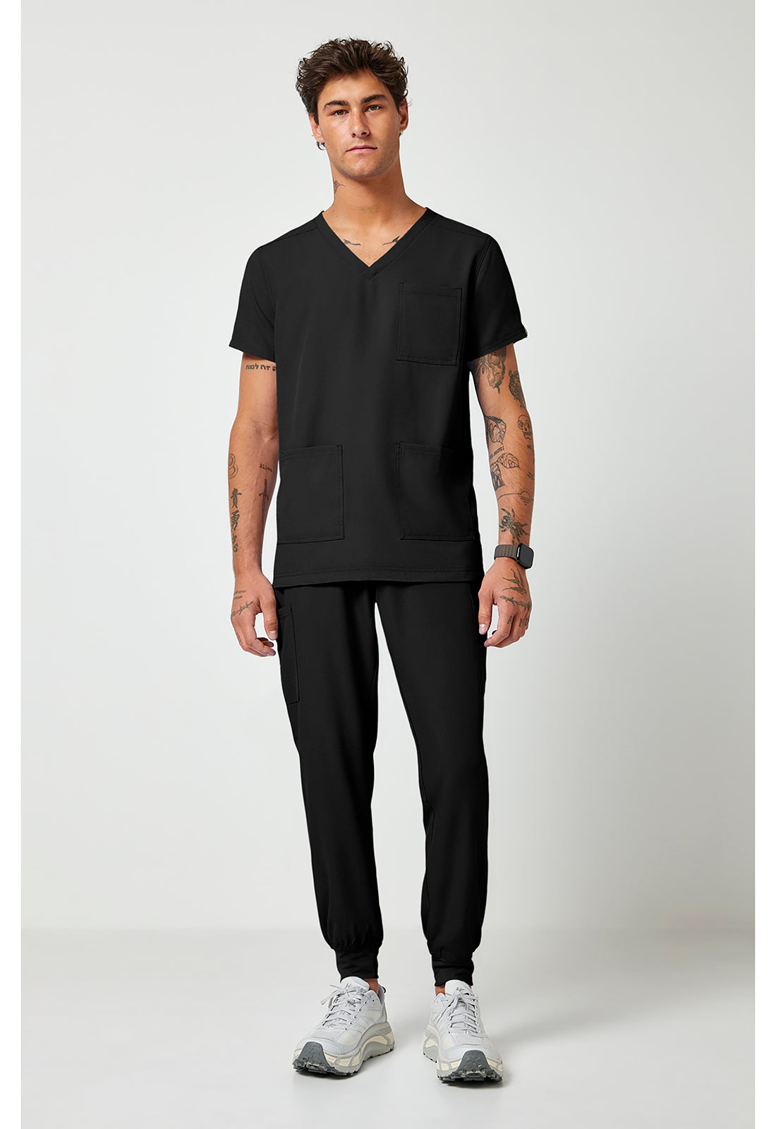 Full view of the Med Couture Rothwear Insight Men's 3-Pocket Scrub Top MC2486 in the colour black.