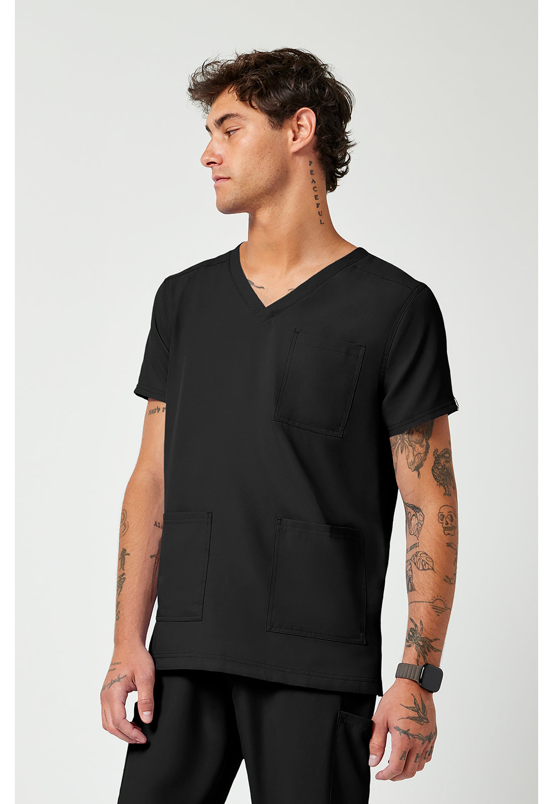 Side view of the Med Couture Rothwear Insight Men's 3-Pocket Scrub Top MC2486 in the colour black.