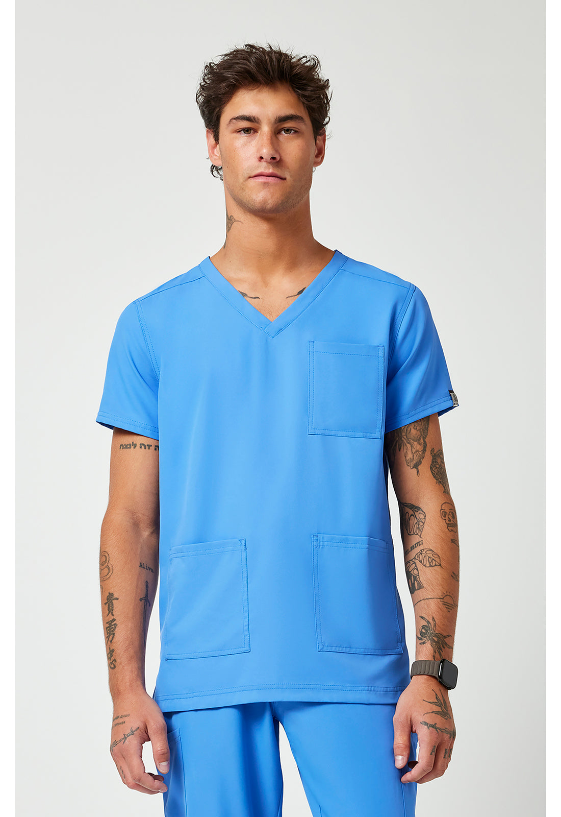 Front view of the Med Couture Rothwear Insight Men's 3-Pocket Scrub Top MC2486 in the colour ceil blue.
