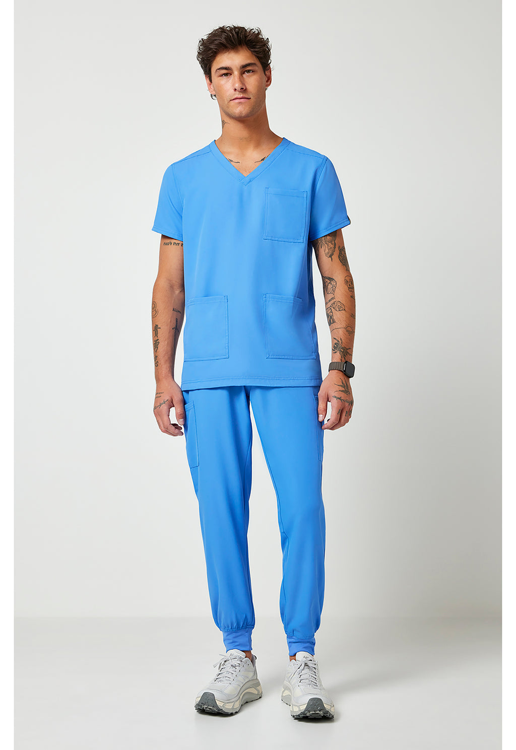 Full view of the Med Couture Rothwear Insight Men's 3-Pocket Scrub Top MC2486 in the colour ceil blue.