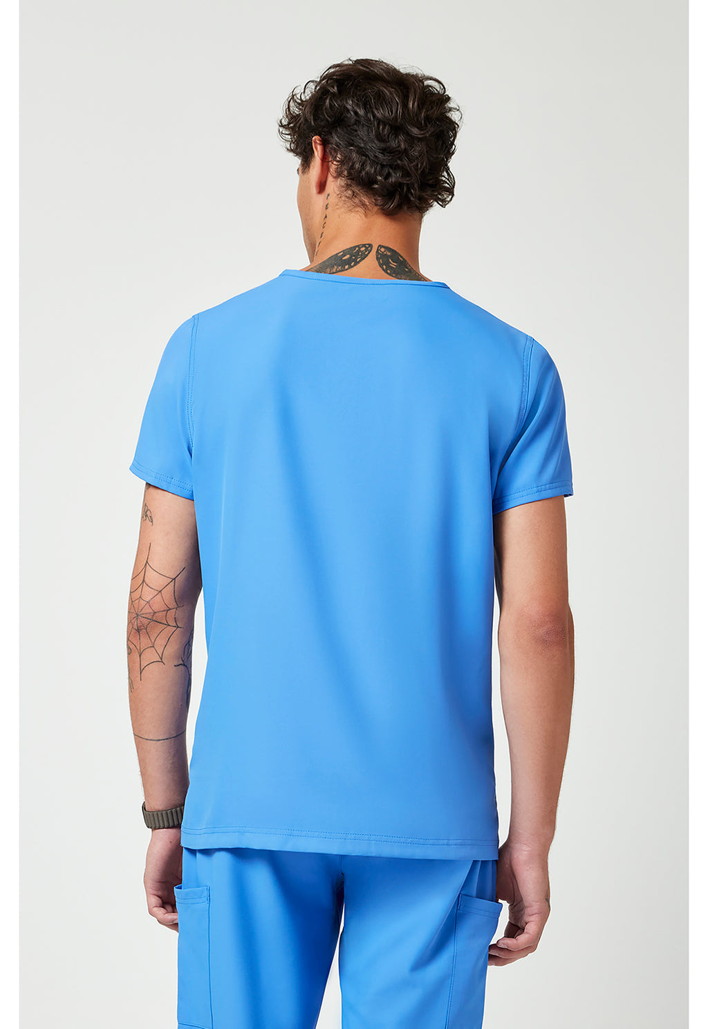 Back view of the Med Couture Rothwear Insight Men's 3-Pocket Scrub Top MC2486 in the colour ceil blue.