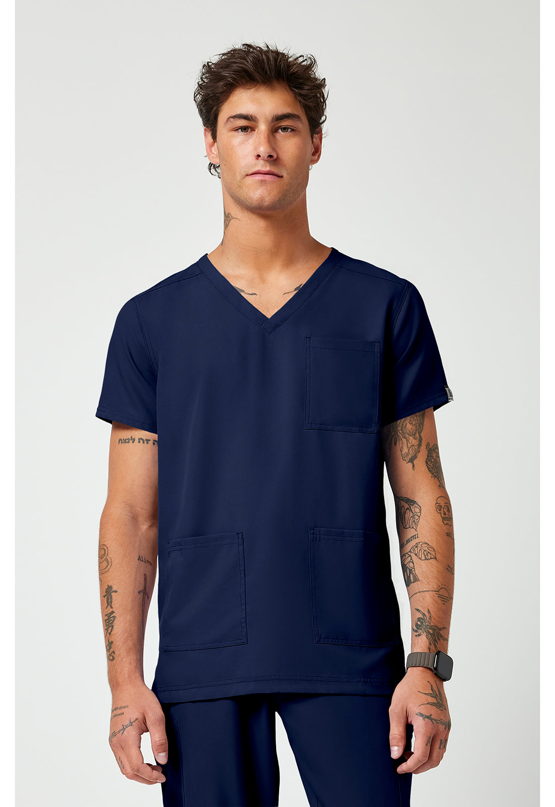 Front view of the Med Couture Rothwear Insight Men's 3-Pocket Scrub Top MC2486 in the colour navy.