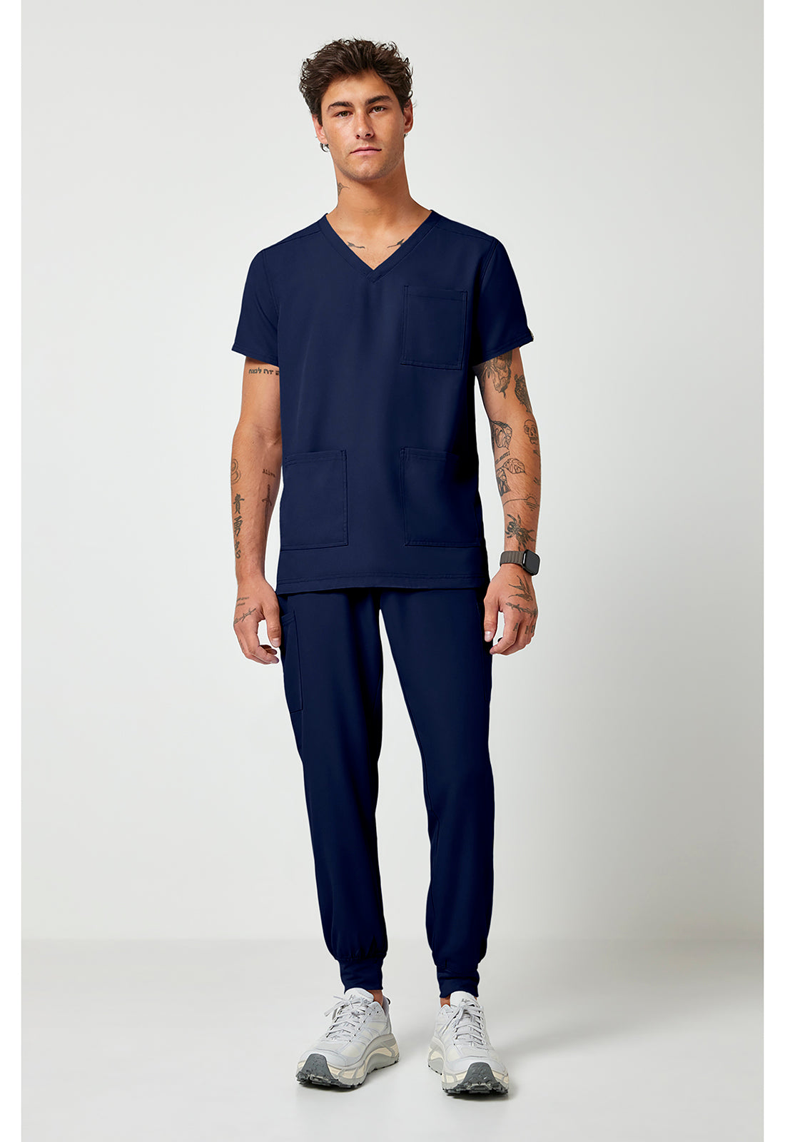 Full view of the Med Couture Rothwear Insight Men's 3-Pocket Scrub Top MC2486 in the colour navy.