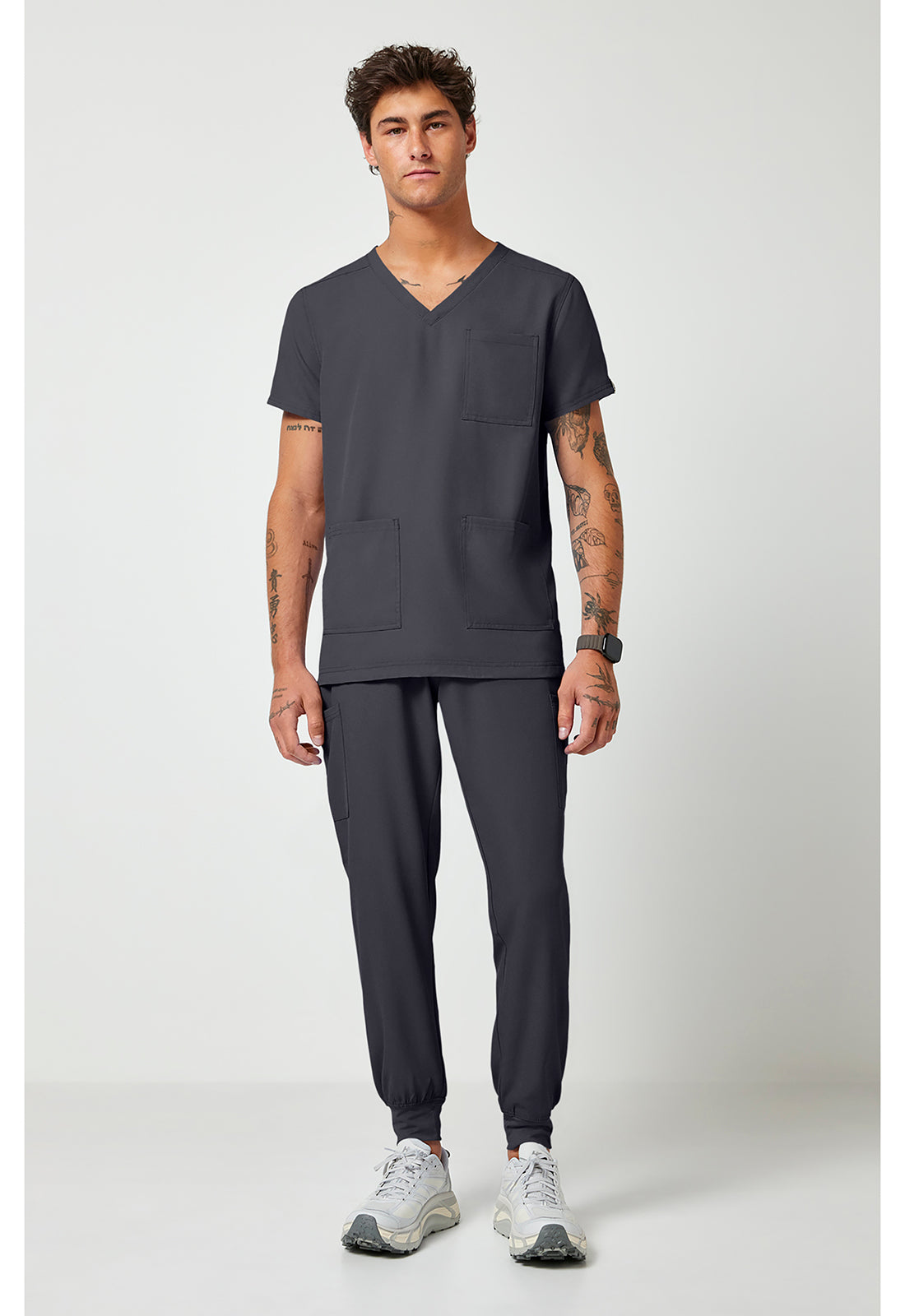 Full view of the Med Couture Rothwear Insight Men's 3-Pocket Scrub Top MC2486 in the colour pewter.