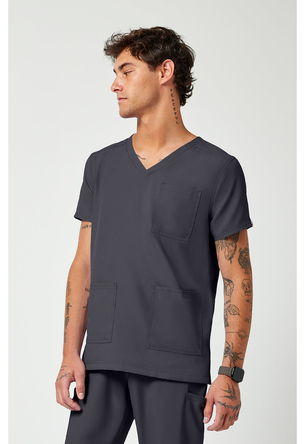 Side view of the Med Couture Rothwear Insight Men's 3-Pocket Scrub Top MC2486 in the colour pewter.