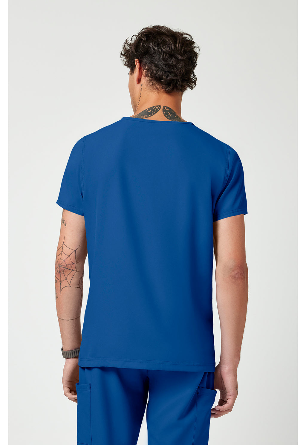 Back view of the Med Couture Rothwear Insight Men's 3-Pocket Scrub Top MC2486 in the colour royal blue.