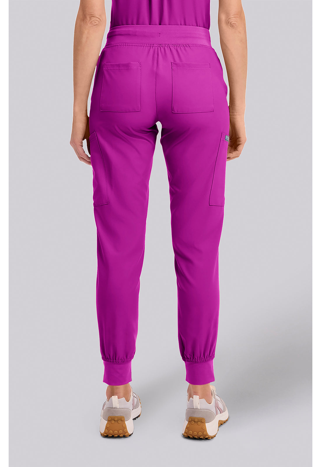 Insight 6-Pocket Scrub Jogger in magenta shown from the back with six pockets elastic ankle cuffs and athletic fit by MED COUTURE Insight