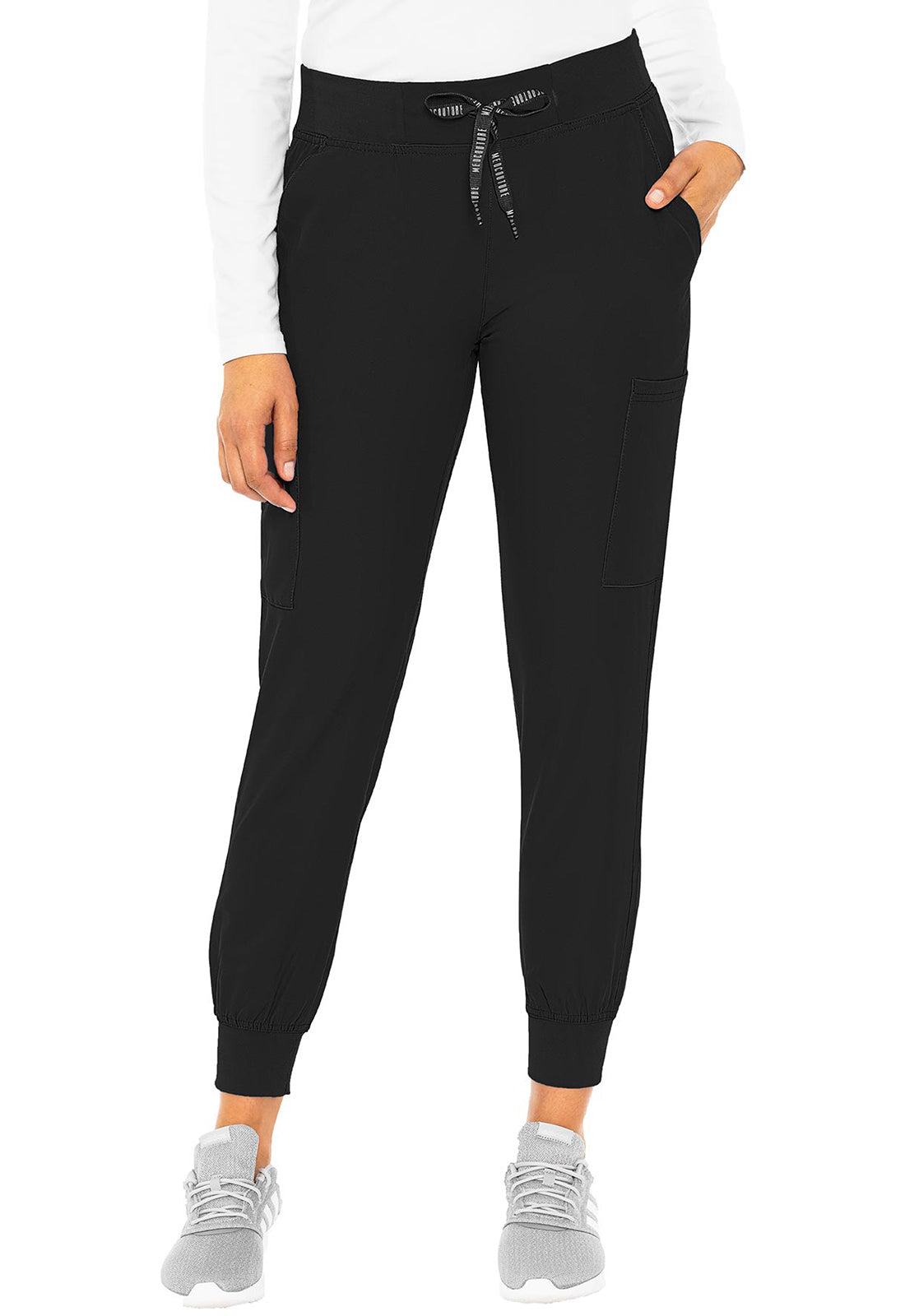 Insight 6-Pocket Scrub Jogger in black with tapered legs and elastic cuffs shown on a model. MED COUTURE Insight scrub workwear.