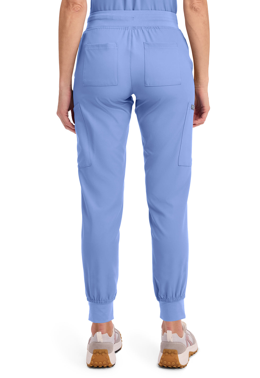 Insight 6-Pocket Scrub Jogger in blue shown from the back with an elastic waist rear pockets and cuffed ankles by MED COUTURE Insight