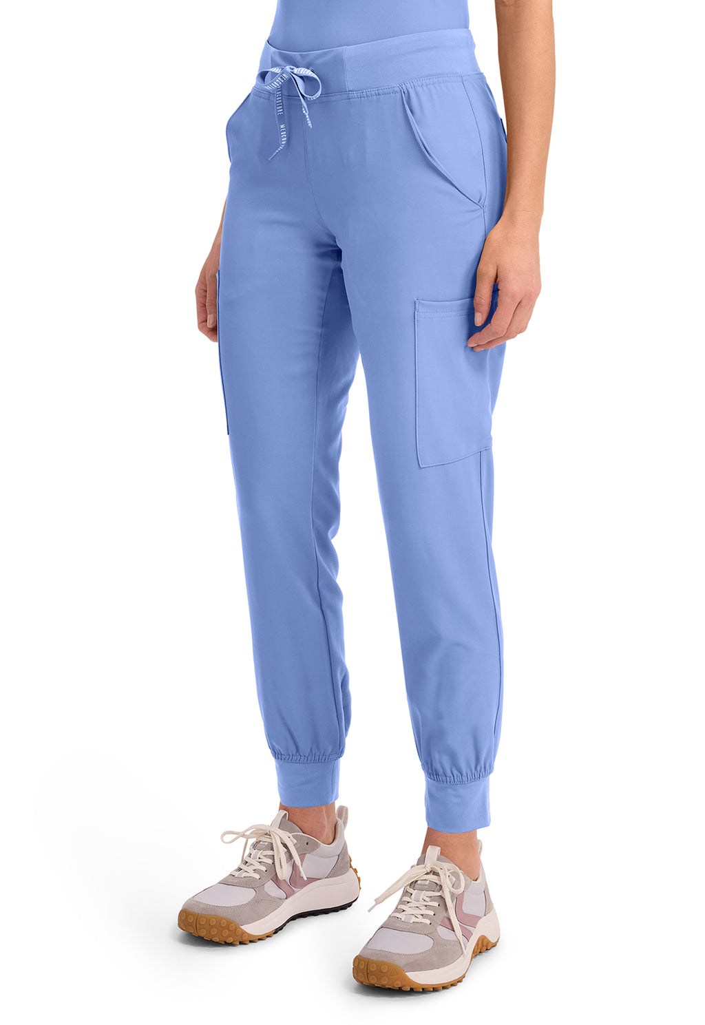 Insight 6-Pocket Scrub Jogger in blue with drawstring waist elastic cuffs and cargo pockets modeled with sneakers by MED COUTURE Insight