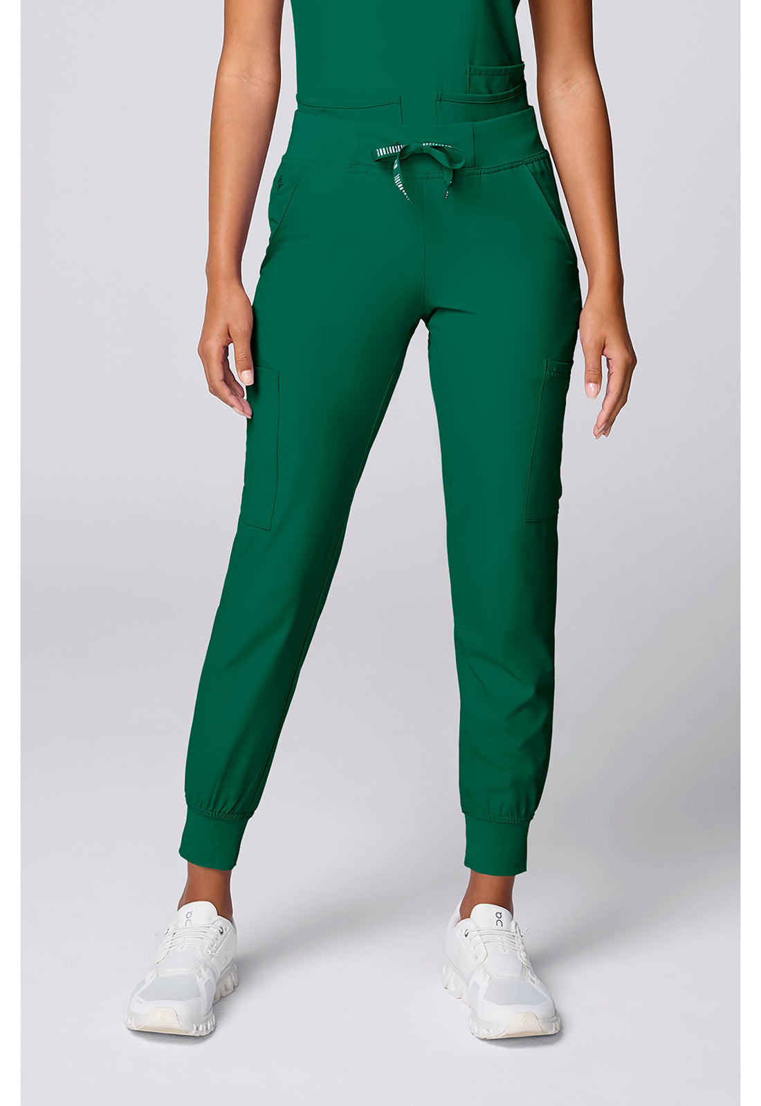 Insight 6-Pocket Scrub Jogger in green worn with a coordinating top and white sneakers by MED COUTURE Insight