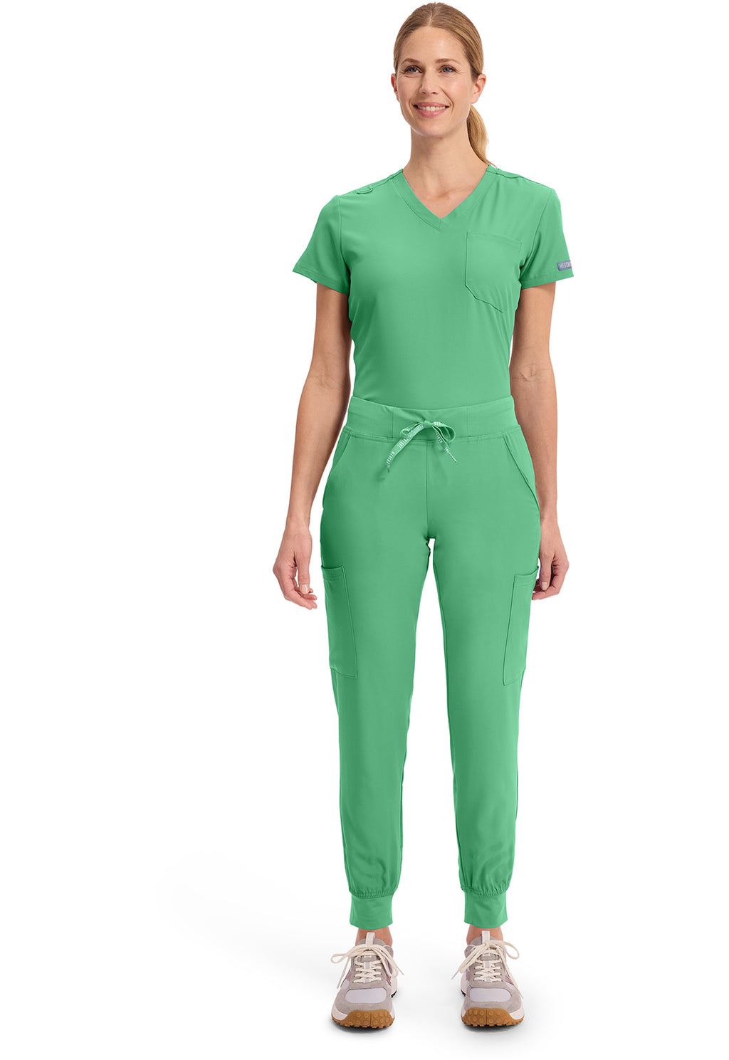 Insight 6-Pocket Scrub Jogger in green worn by a female model with a drawstring waist tapered legs and elastic cuffs for comfortable medical workwear