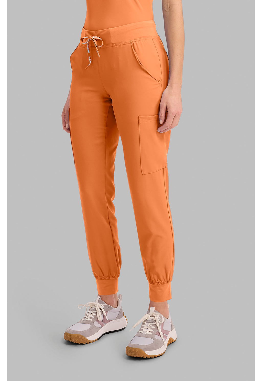 Insight 6-Pocket Scrub Jogger in orange with drawstring waist and jogger cuffs shown with MED COUTURE Insight performance scrub workwear pants