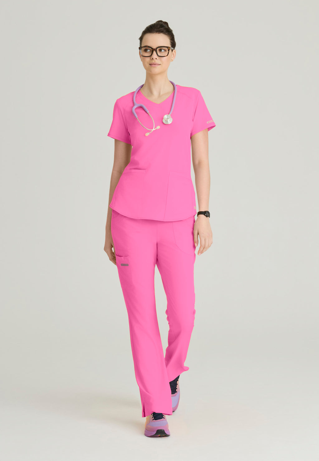 Full view Skechers Women's Breeze scrub top in the colour Passion Pink.
