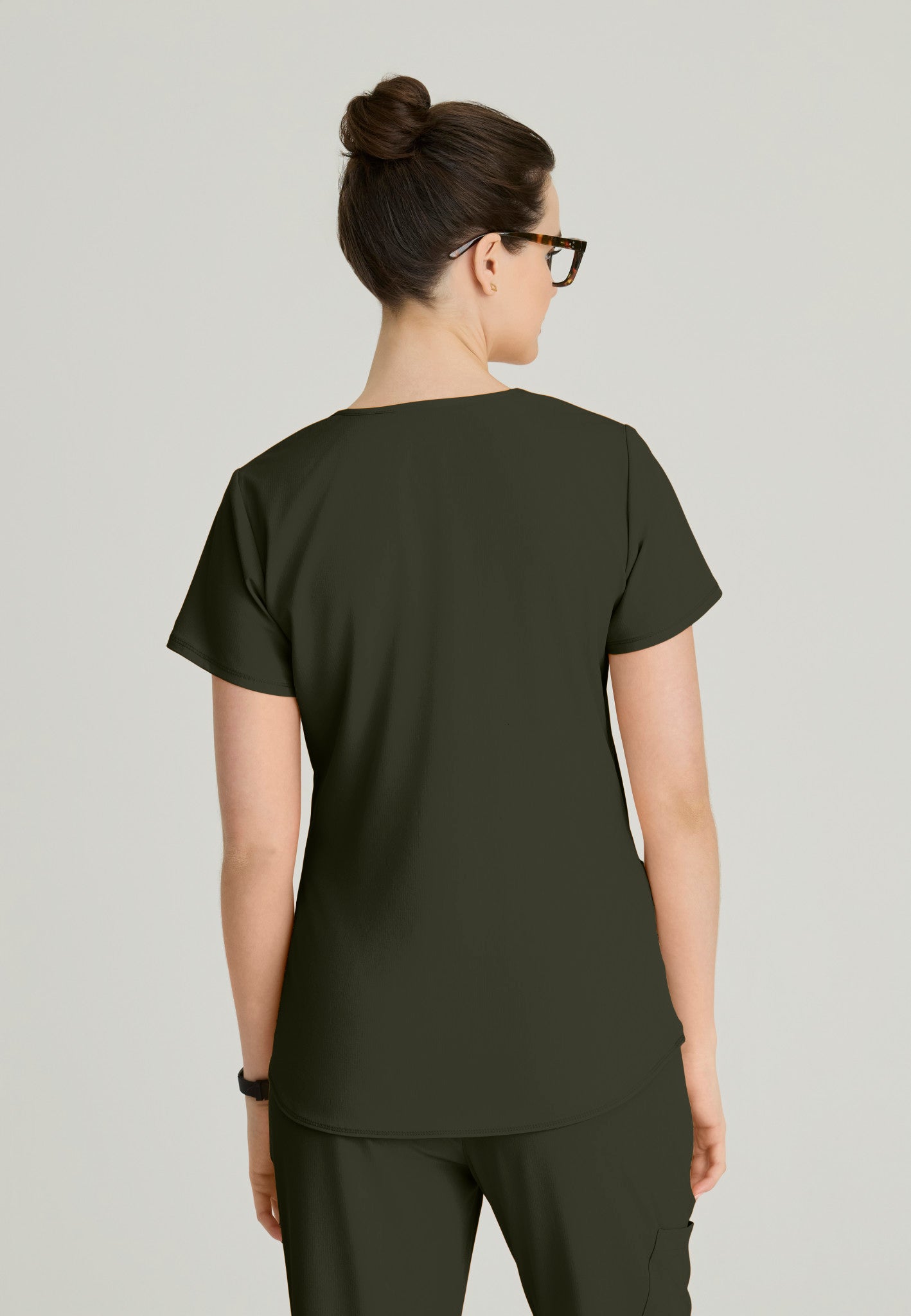 Back view of the SK101 Skechers Breeze women's scrub top in the colour Olive.