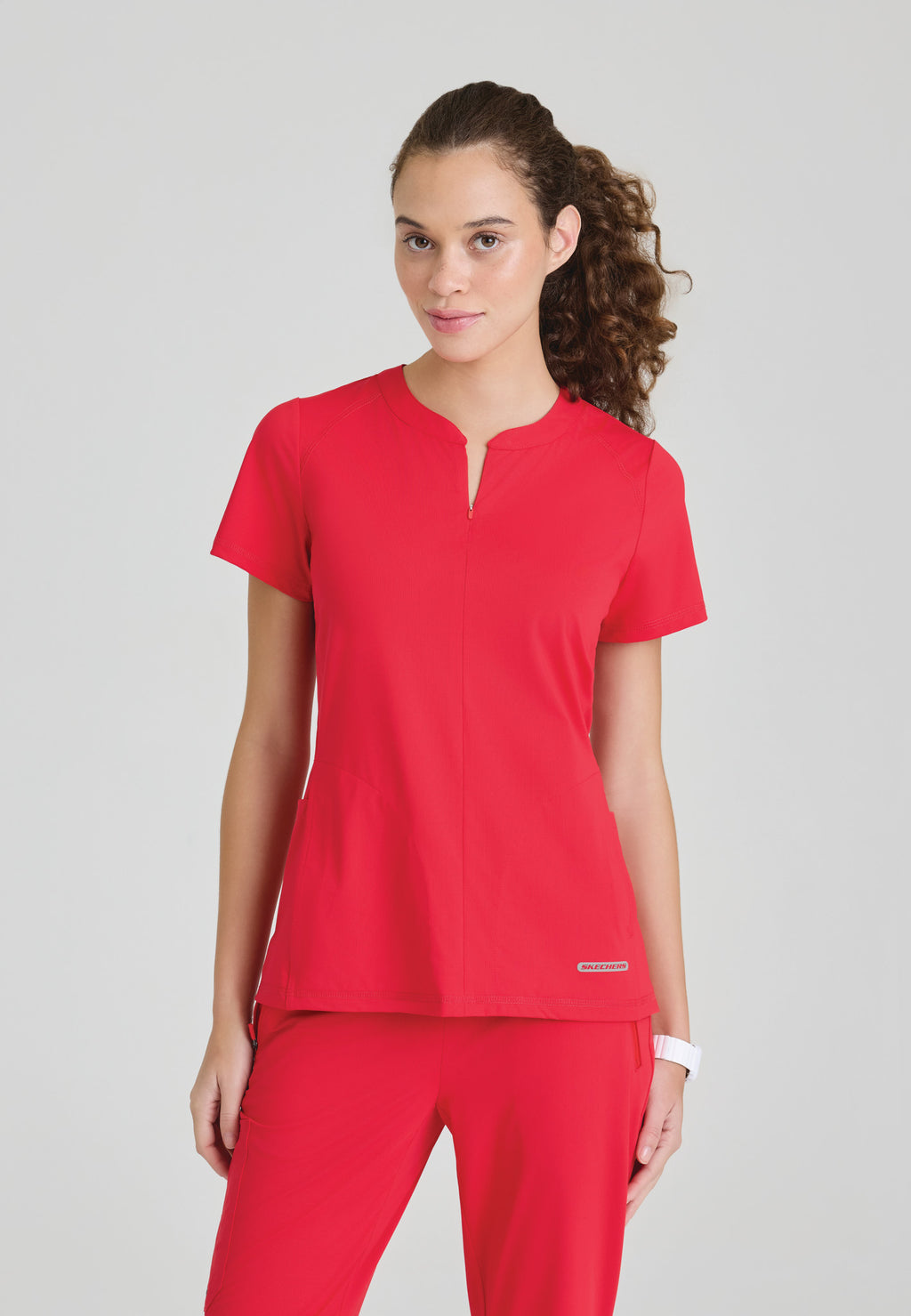 Front view of the Skechers Slip-Ins Glide scrub top in the colour Hero.