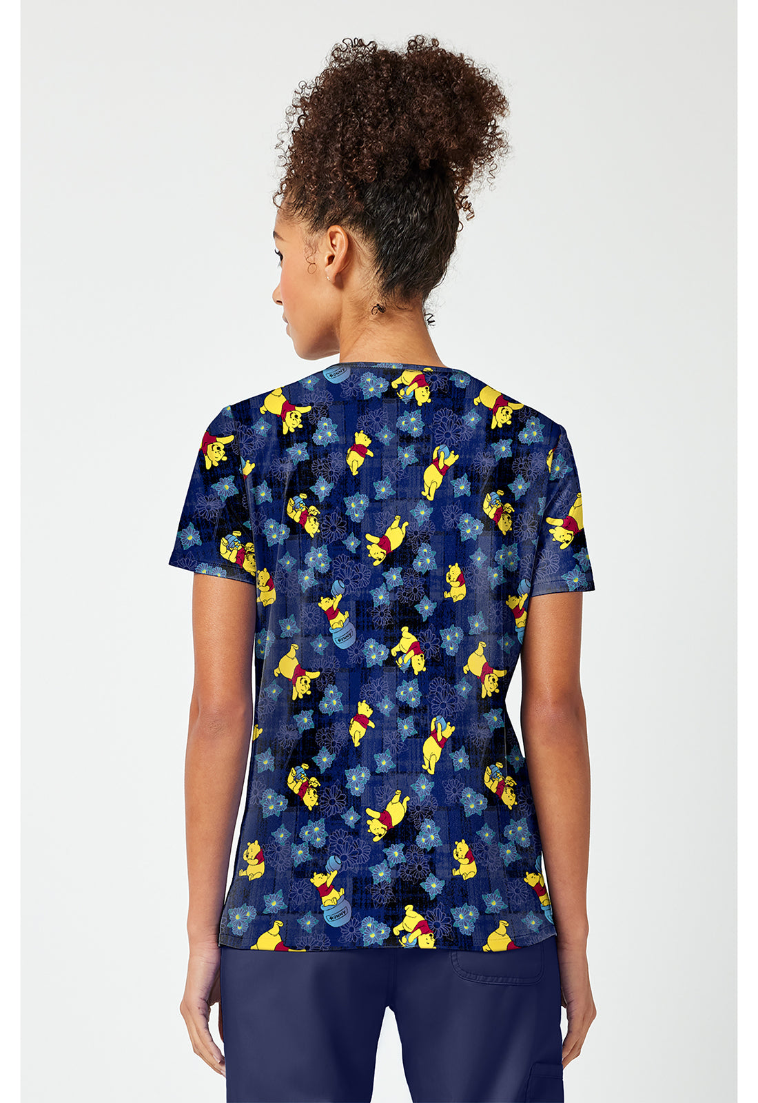 Back view of the Winnie The Pooh Plaid Petals Scrub Top