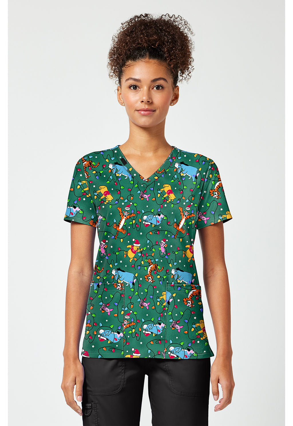 Front view of the Winnie The Pooh Holiday Helpers Scrub Top
