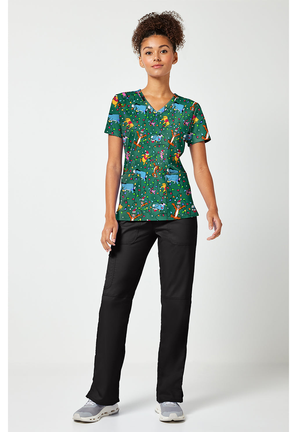 Full view of the Winnie The Pooh Holiday Helpers Scrub Top
