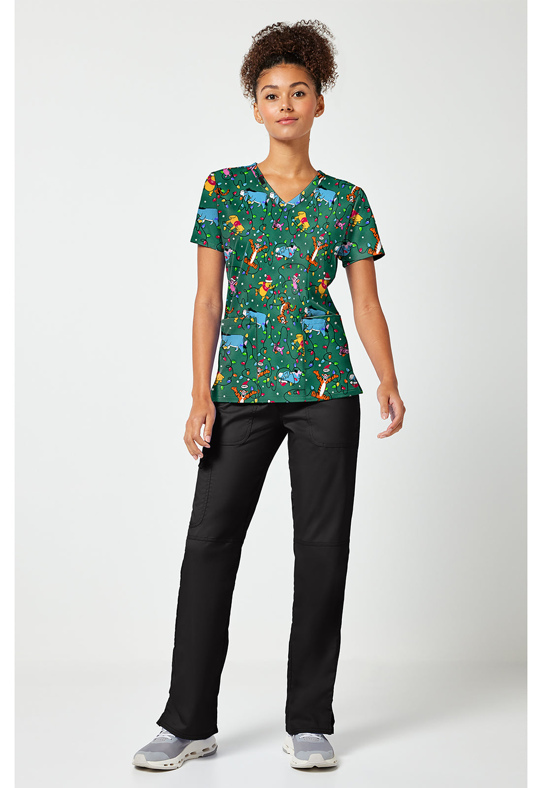 Full view of the Winnie The Pooh Holiday Helpers Scrub Top