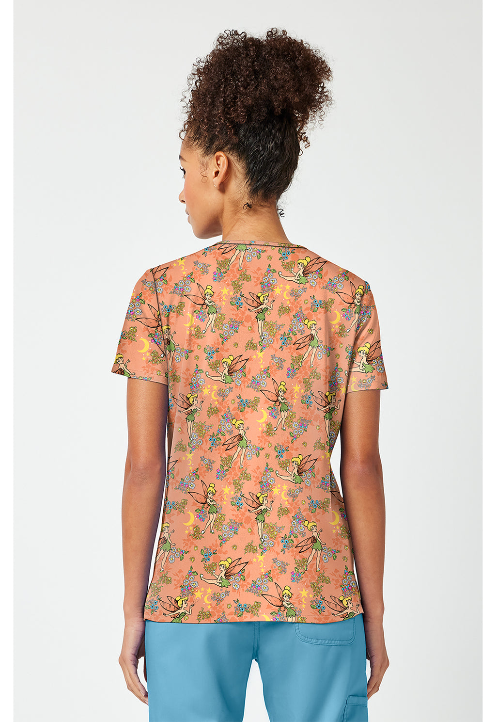 Side view of the Tinkerbell Pixie Petals Scrub Top