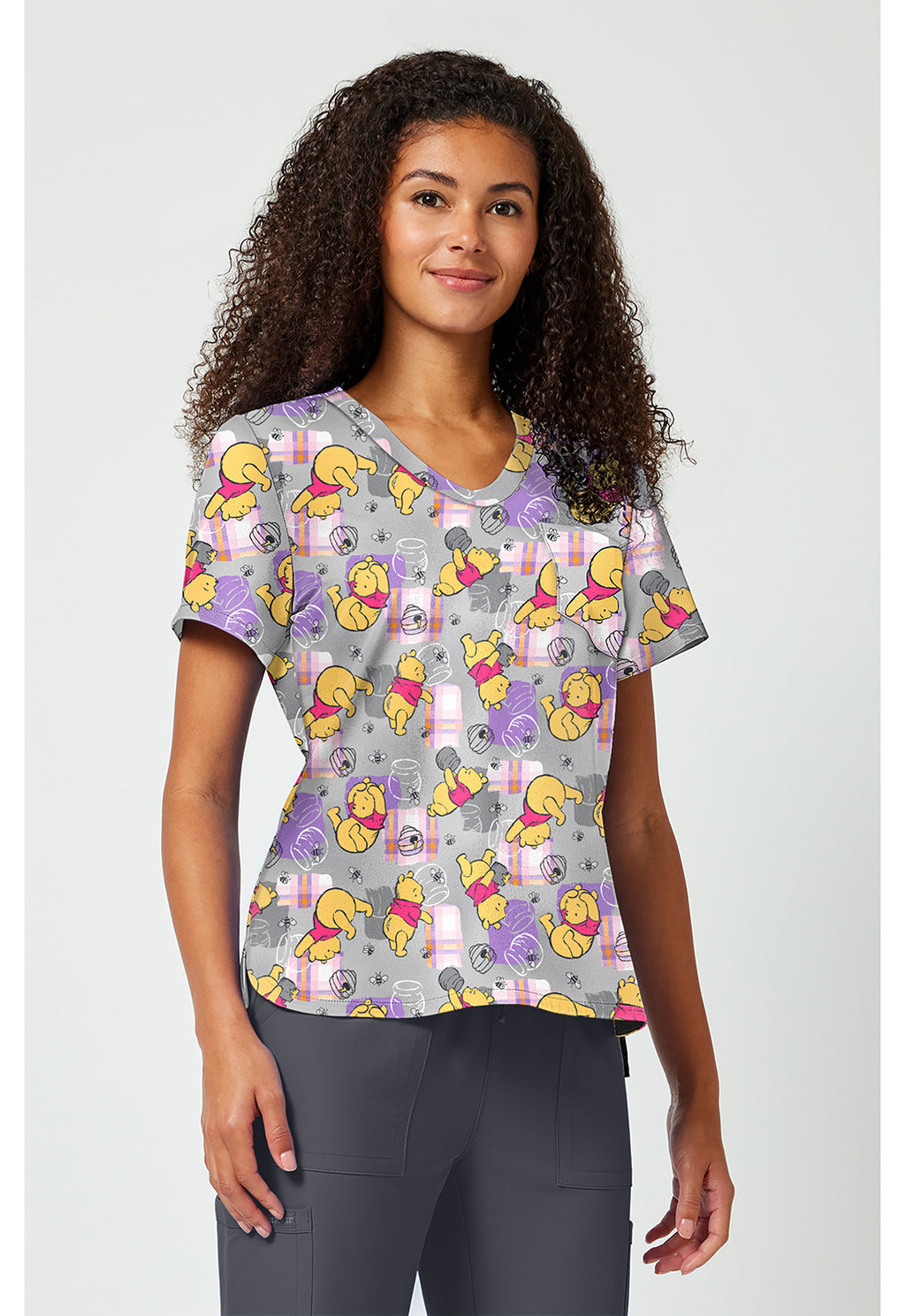 Front side view of Tooniforms Winnie The Pooh Honey Plaid Scrub Top TF797 PHHY
