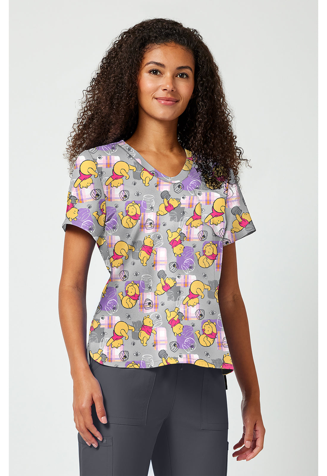 Front side view of Tooniforms Winnie The Pooh Honey Plaid Scrub Top TF797 PHHY